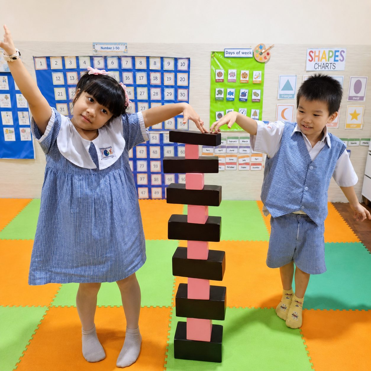 Two children with the Pink Tower and Brown Stair